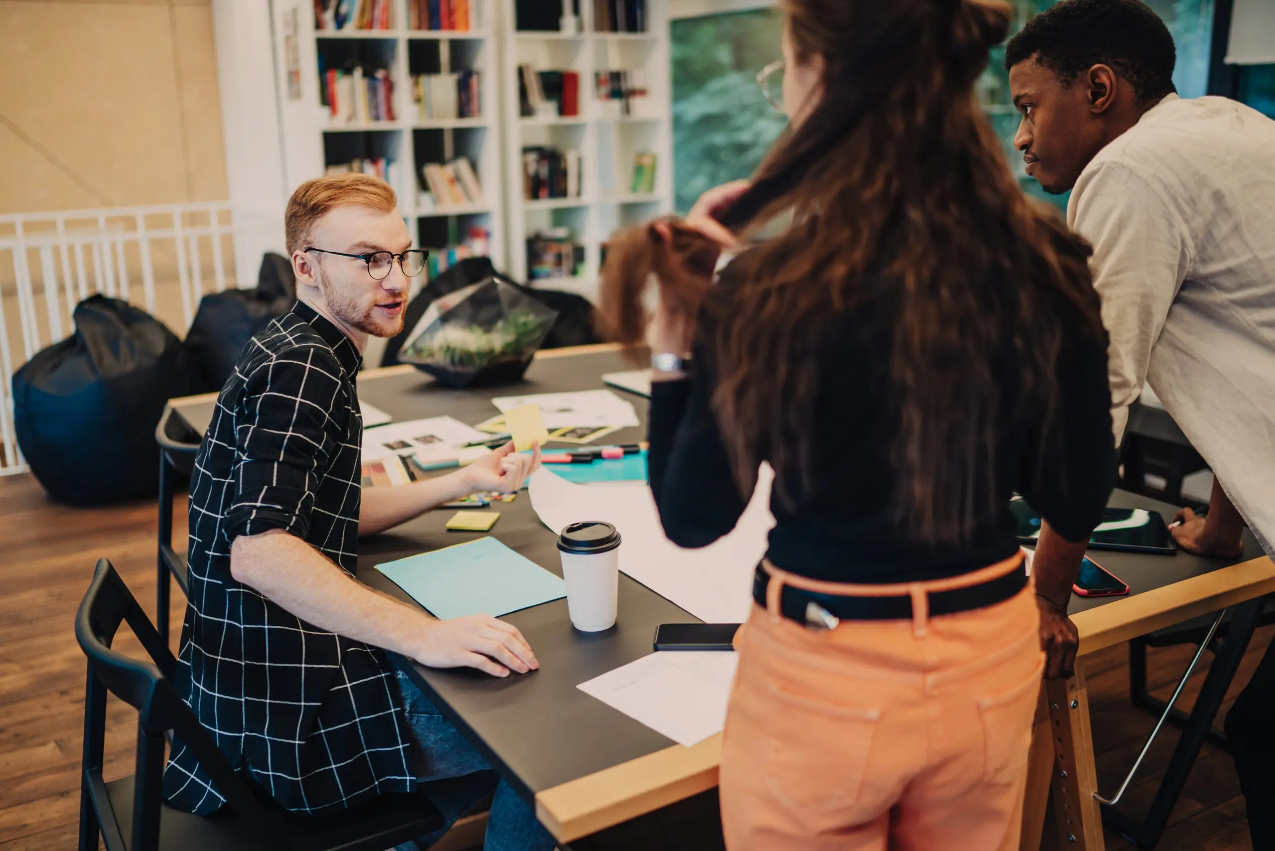 Facilities and Schools 15 | smart colleagues discussing work ideas in workspac 2023 12 15 22 17 18 utc scaled The Role AI Plays in Workplace Safety and Compliance